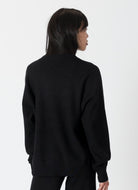 Lyla + Luxe Claret Crewneck Sweater in Black Back View