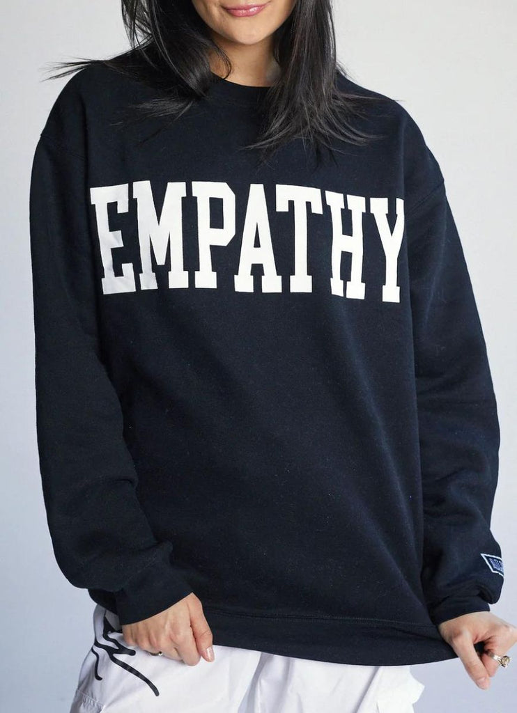 The Mayfair Group Empathy Always Women's Crewneck in Black Close Up Front View of Empathy Design