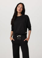 Vuori Women's Long Sleeve Halo Crew in Heather Black Front View
