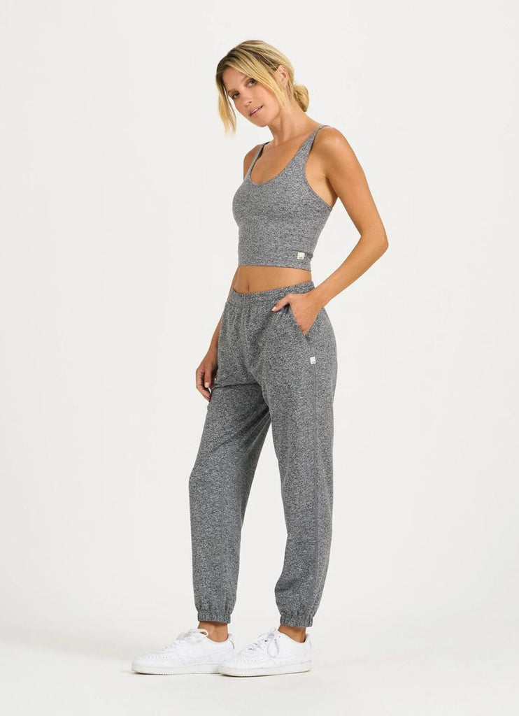 vuori Halo Performance Women's Crop in Heather Grey Full Model Side View with Hand in Pocket