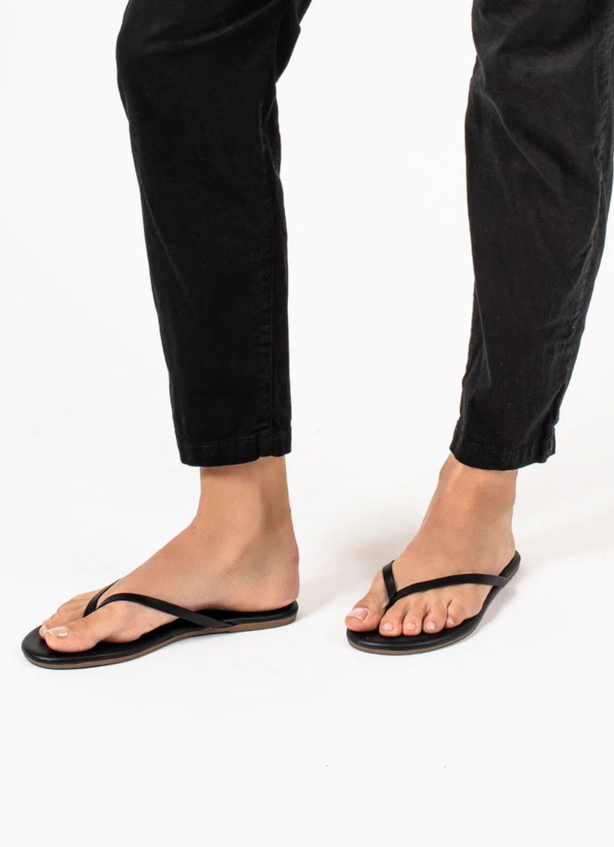 TKEES Lily Liners Flip Flops in Black Shown on Feet