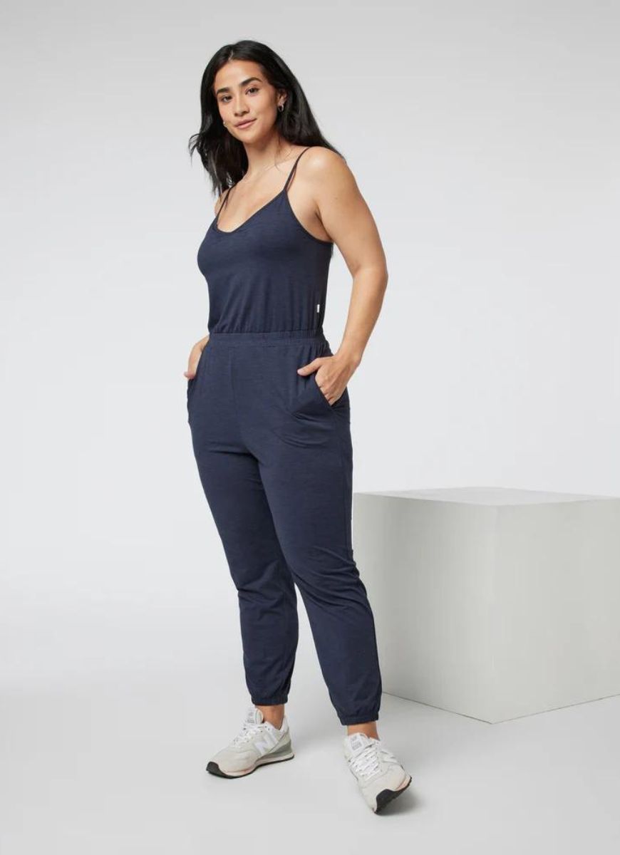Vuori Lux Jogger Jumpsuit in Midnight Heather Front View with Hands in Pockets