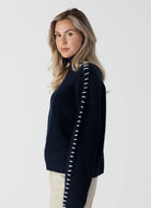 Lyla + Luxe Nyla Mockneck Sweater in Navy/White Side View