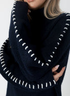 Lyla + Luxe Nyla Mockneck Sweater in Navy/White Close Up View