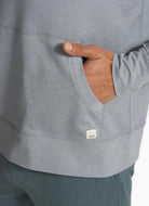Vuori Mens' Ponto Performance Half Zip Hoodie in Steel Heather Close Up View of Hand in Pocket