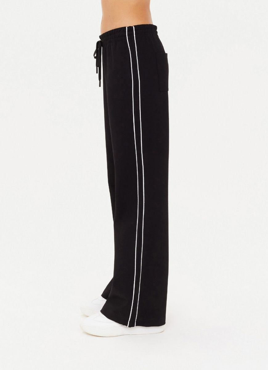 The Upside Realm Jetset Pant in Black Waist Down Side View