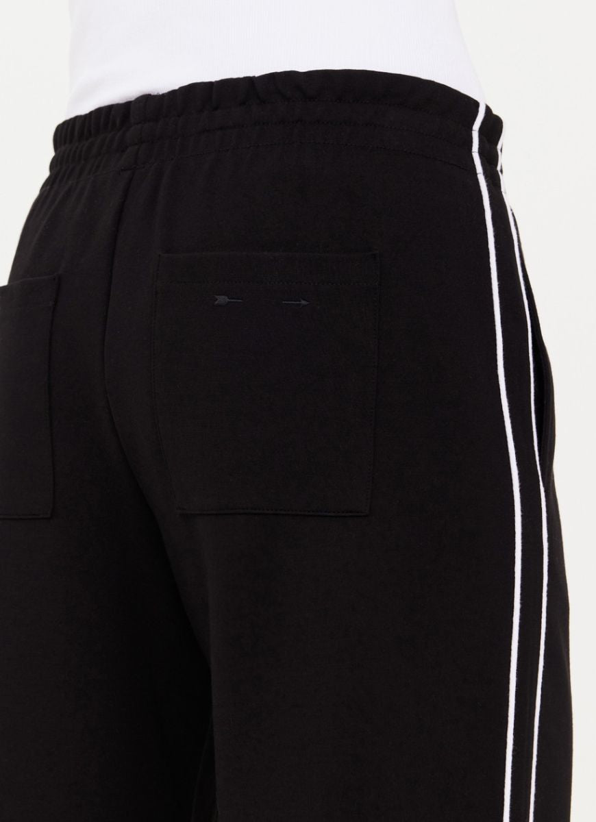 The Upside Realm Jetset Pant in Black Close Up Back View of Pockets