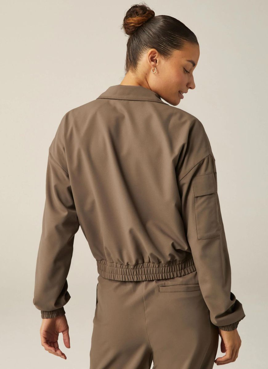 Beyond Yoga Status Pocket Sleeve Cropped Jacket in Dune Back View