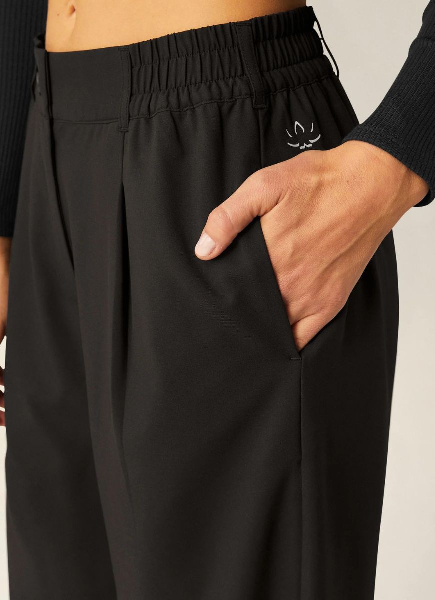 Beyond Yoga Status Wide Leg Trousers in Black Close Up View of Hand in Pocket