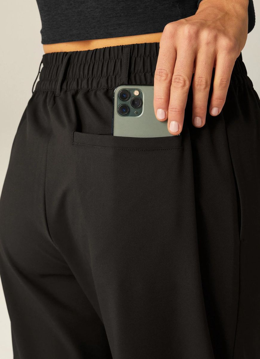 Beyond Yoga Status Wide Leg Trousers in Black Close Up Back View of Mobile Phone in Back Pocket