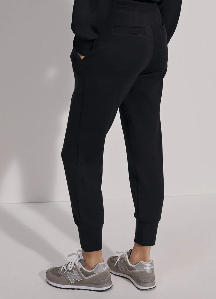 Varley The Slim Cuff Pant 25” in Black Waist Down Back View