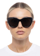 Le Specs Air Heart Women's Polarized Sunglasses in Black Shown on Model Front View