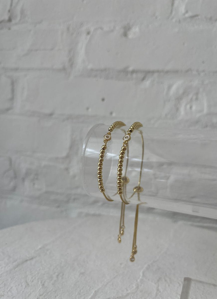 Lo & Co Bead Ball Eyes Bracelet Showing Two on a Jewelry Stand