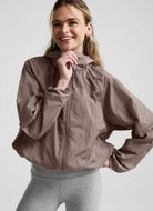 Beyond Yoga Limitless Hooded Jacket in Rosey Taupe Front View