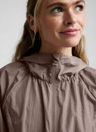 Beyond Yoga Limitless Hooded Jacket in Rosey Taupe Close Up Front View Zipped Up