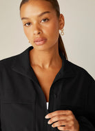 Beyond Yoga City Chic Women's Jacket in Black Close Up View of Front Zipper