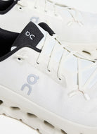 On Women's Cloudtilt Running Shoe in Pearl/Ice Close Up View of Logo