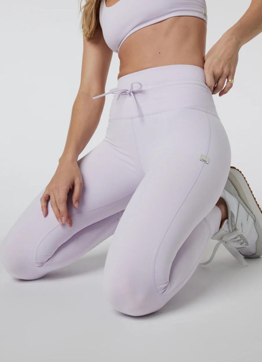 Vuori Daily Legging in Opal Close Up Front View With Model Kneeling