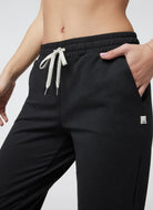 vuori Granite Performance Jogger in Black Heather Close Up View of Hand in Pocket