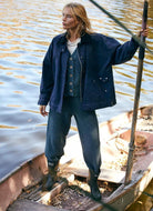 Free People Hailee Cardi Set in Balsam Front View with Model Standing in a Canoe