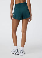 Vuori Women's Halo Performance Short 2.0 in Moss Heather Back View