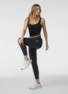 Vuori Halo Essential Tank Top in Black Heather Full Length Front View Model in a Pose