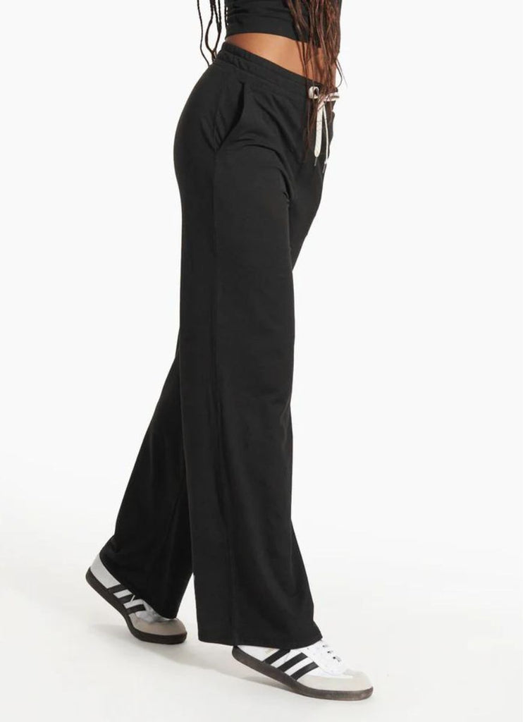 vuori Women's Halo Essential Wideleg Pant in Black Side View