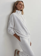 Varley Hawley Half Zip Sweat in White Side View With Model in a Pose