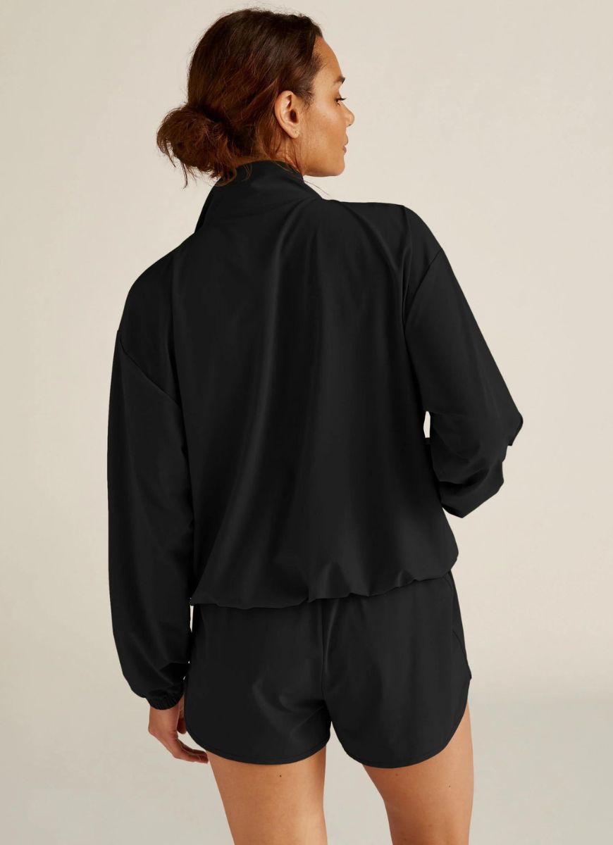 Beyond Yoga Stretch Woven In Stride Half Zip Pullover in Black Back View