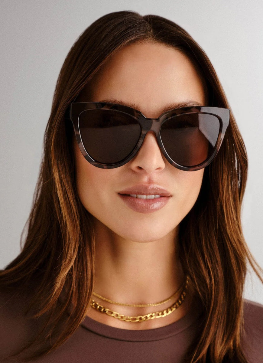 Le Specs Liar Liar Women's Sunglasses in Volcanic Tort Front View Shown on Face