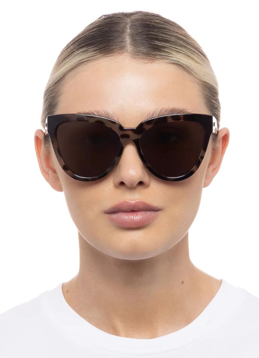 Le Specs Liar Liar Women's Sunglasses in Volcanic Tort Shown on Model Front View
