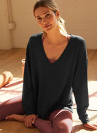 Beyond Yoga Long Weekend Lounge Pullover in Black Model Sitting Down