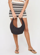 LSPACE Caicos Skirt in Caicos Stripe Model Showing Holding a Bag