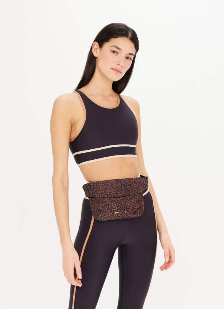 The Upside Women's Malo Belt Bag in Leopard Front View Worn on Waist