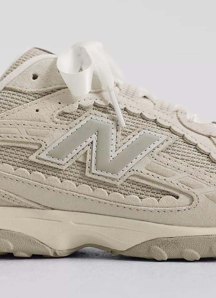 New Balance Women's 204L Sneaker in Sea Salt With Linen Close Up View of Logo