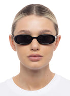 Le Specs Outta Love Sunglasses in Black Shown on Model Front View