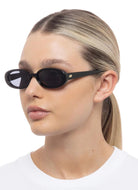 Le Specs Outta Love Sunglasses in Black Shown on Model Side View
