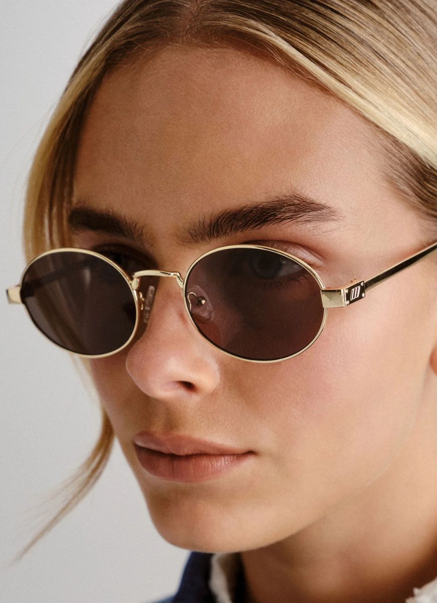 Le Specs Poseidon Deux Women's Sunglasses in Gold Khaki Close Up View Shown on Model