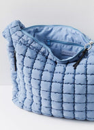Free People Quilted Carryall Bag in Dusty Blue Showing in Inside of Bag