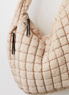 Free People Quilted Carryall Bag in Off White Close Up View of Zippers