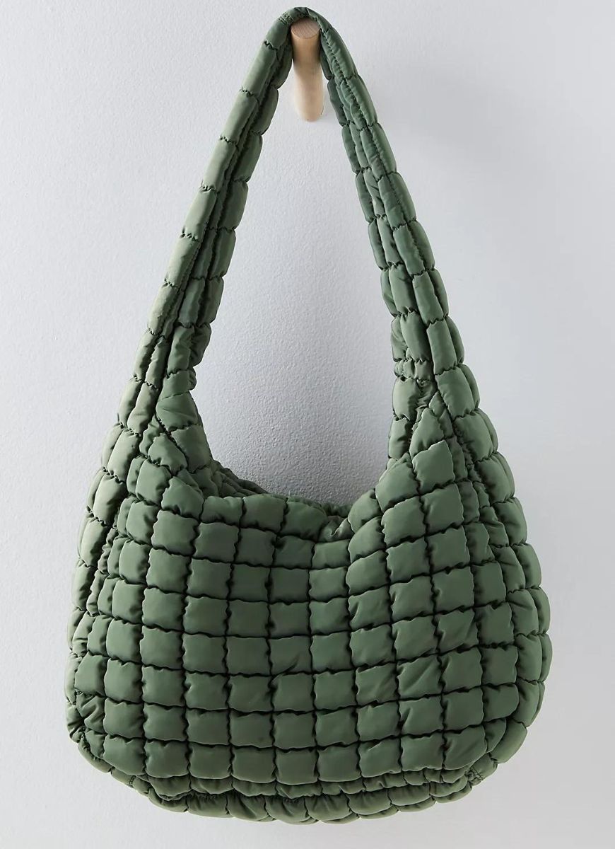 Free People Quilted Carryall Bag in Washed Sage Front View Hanging on a Wooden Peg