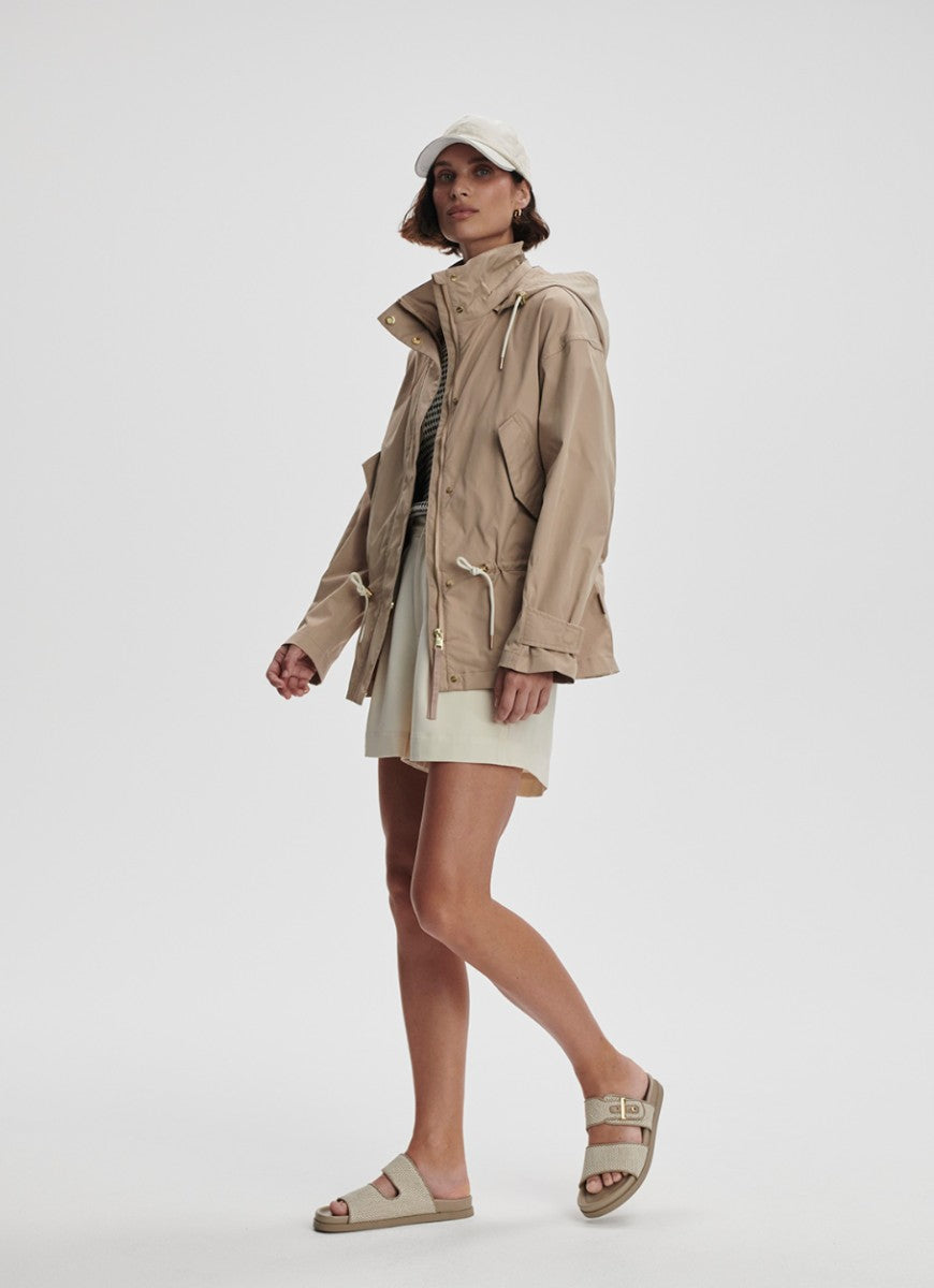 Varley Rema Short Rain Jacket in Light Taupe Full Length Angled Side View