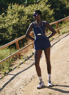 Free People Righteous Runsie in Supernova Full Length Front View Showing Model on a Running Trail