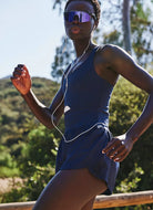 Free People Righteous Runsie in Supernova Side View Showing Model Running