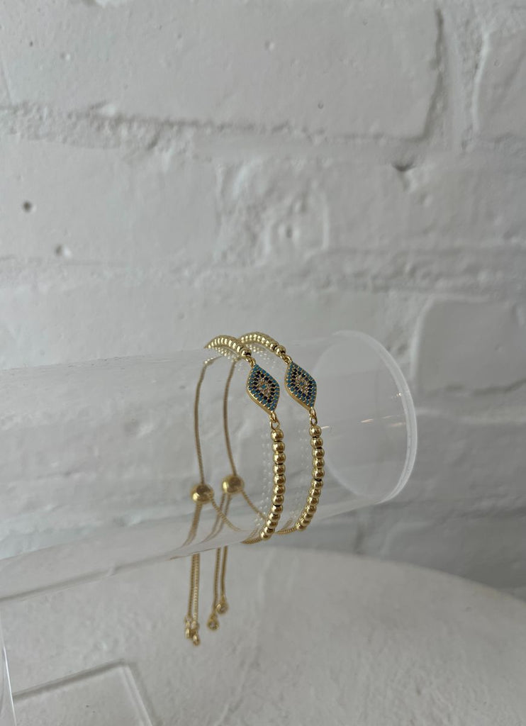 Lo & Co Sparkly Eye Bracelet Shown on Clear Stand