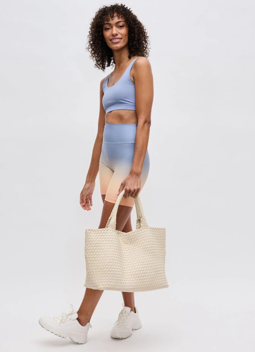 Sol and Selene Sky’s The Limit Large Tote in Cream Full View with Model Holding the Bag by it's Straps