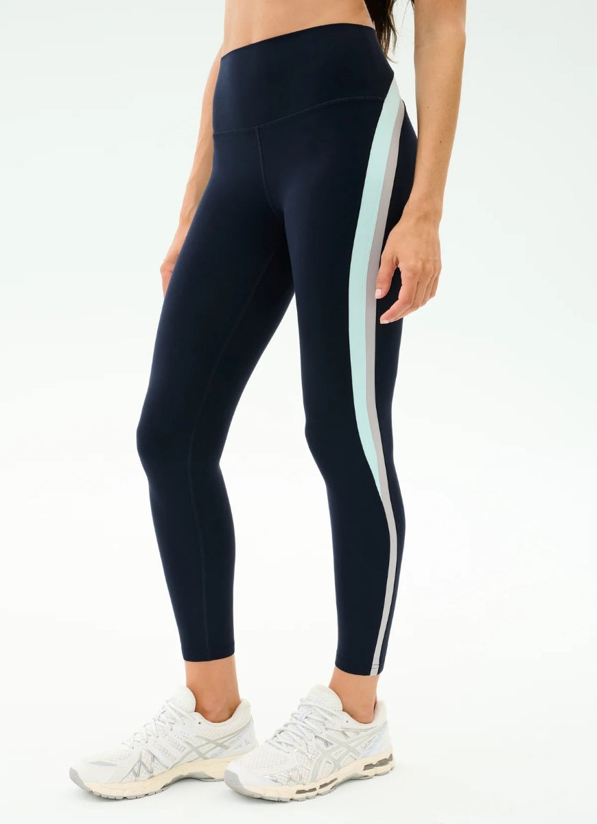 Black leggings with a light blue stripe on a white background