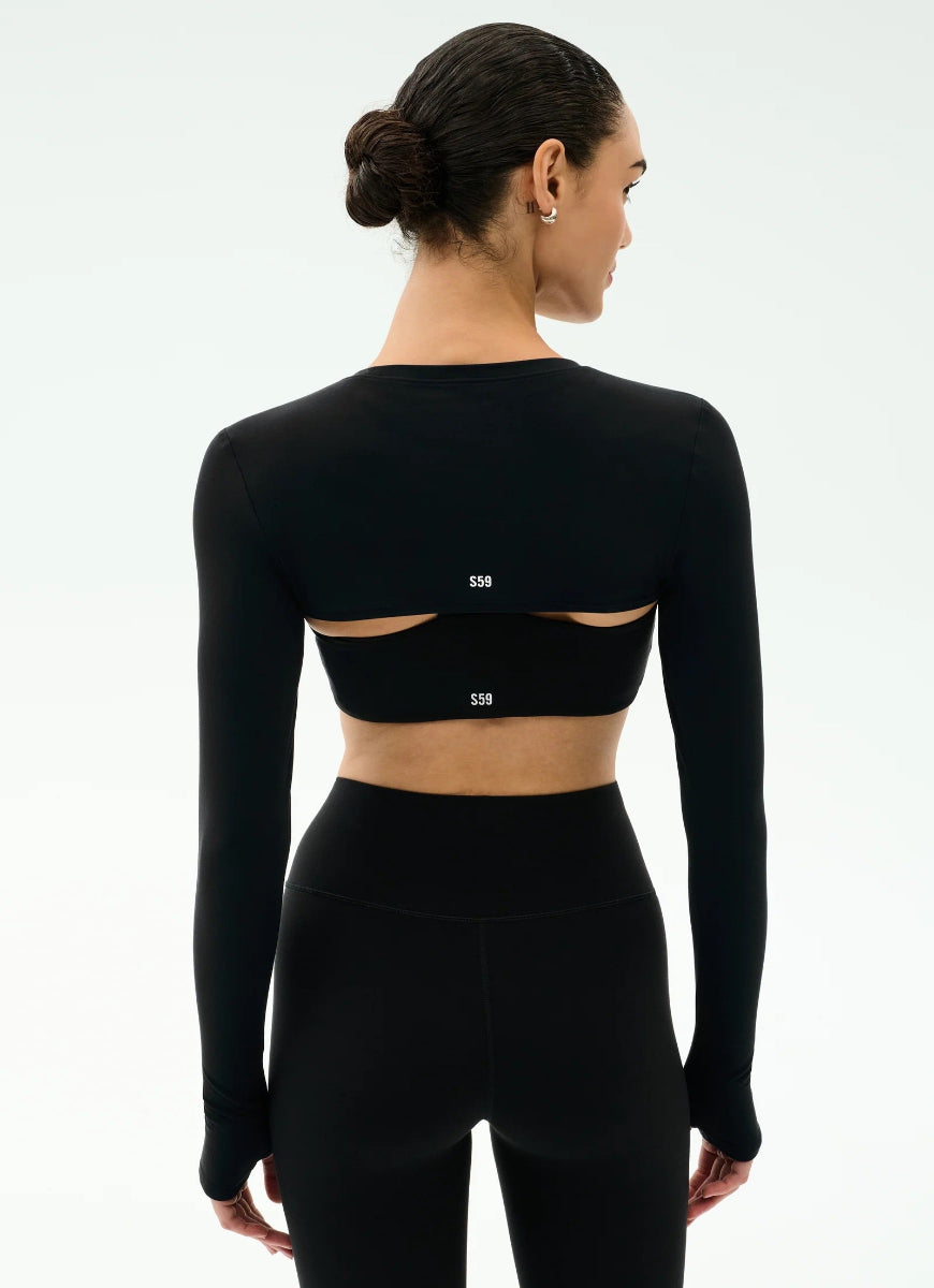 Black long-sleeve athletic top with cut-out design on a white background