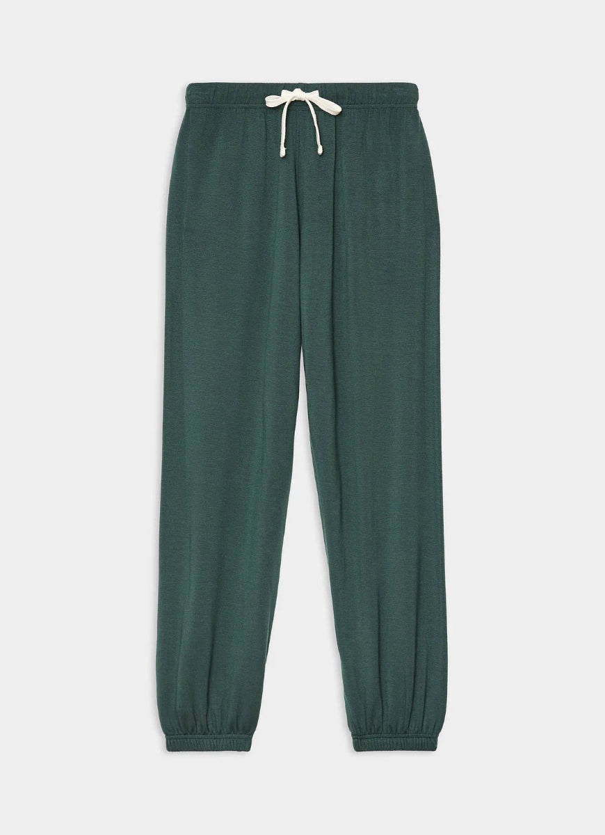 Green sweatpants with a drawstring on a light gray background