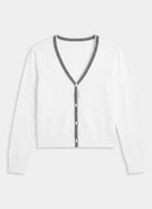 White long-sleeve top with black trim on a light gray background